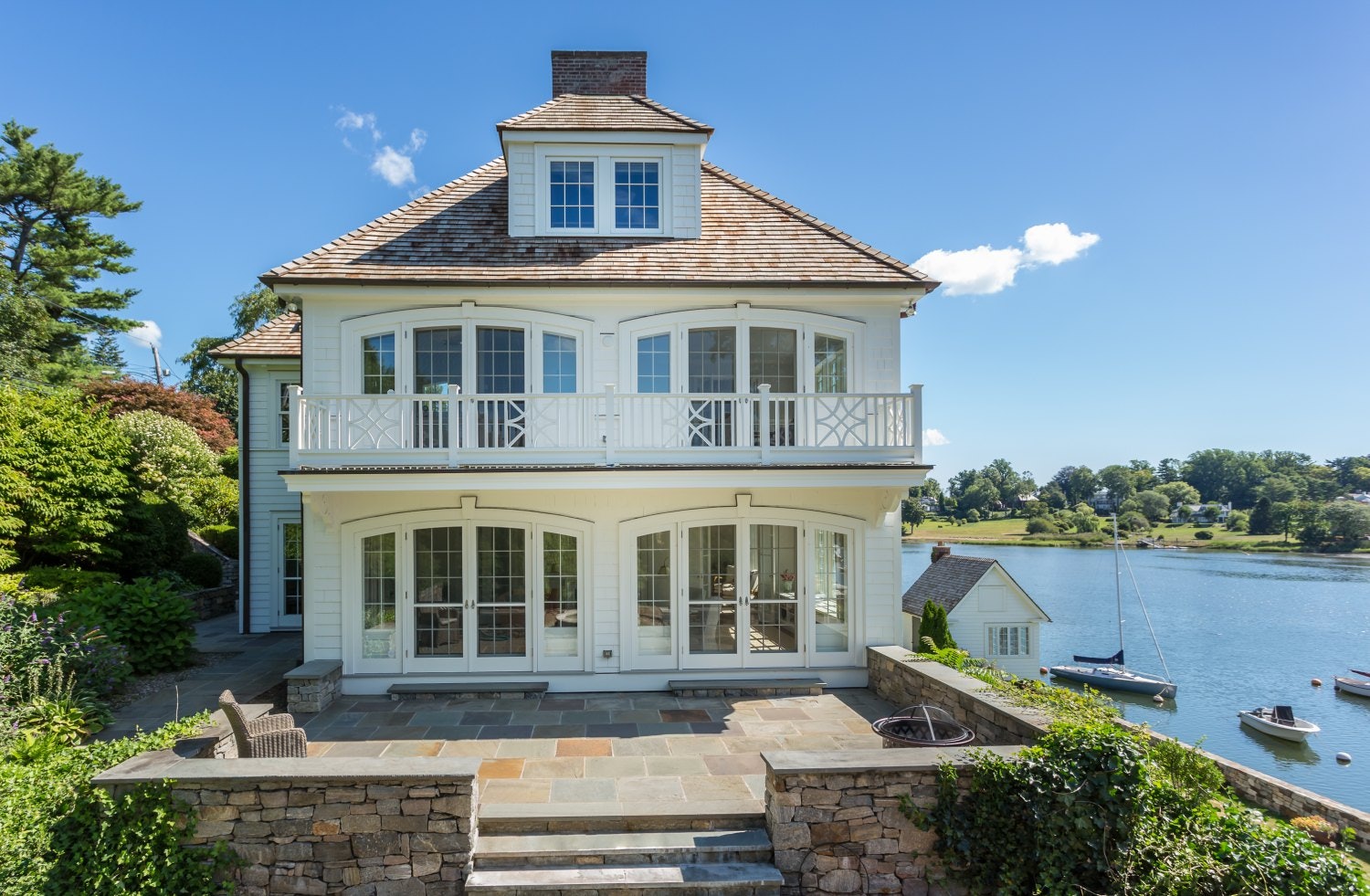 Traditional Home Exterior with Balcony and French Doors