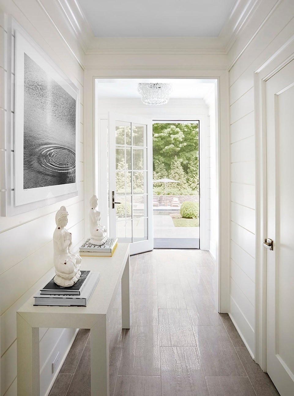 Hallway with Buddha and French Doors